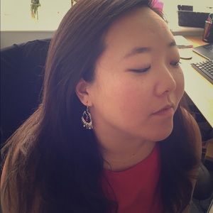 Silver earrings with red bead detail