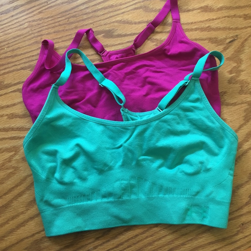 Pair of Under Armor seamless sports bras.