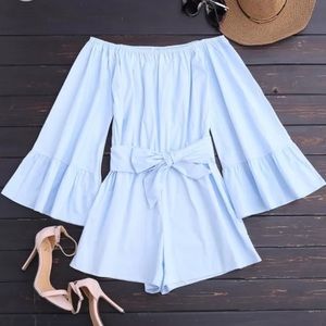 Blue and white striped sleeveless dress.