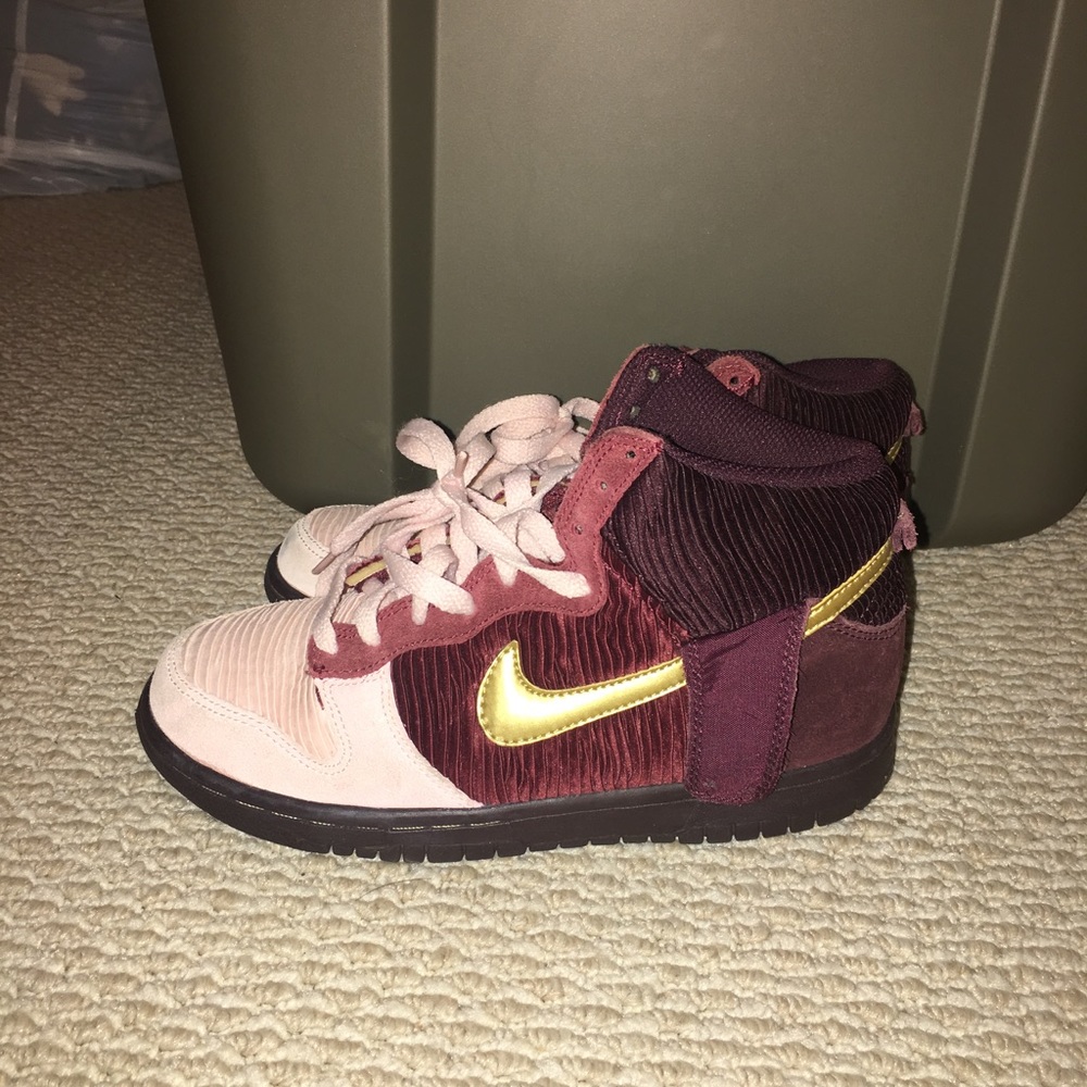 Pink and maroon high top Nike sneakers