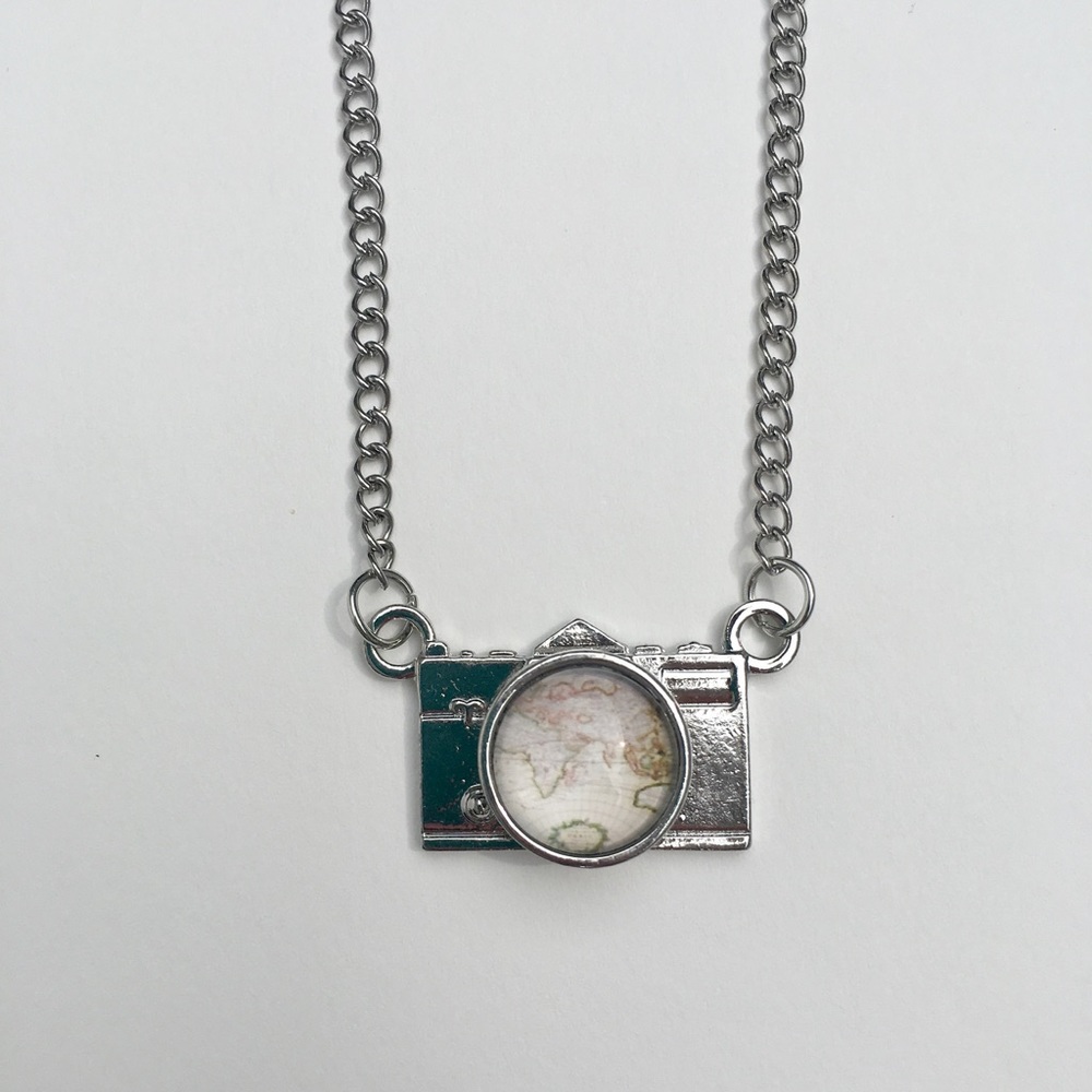 Camera necklace / pendant with globe image in lens