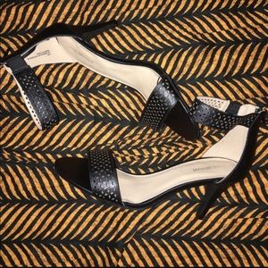 Ankle strap cutout heels.