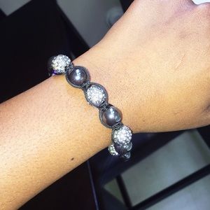 Adjustable diver and gray ball bracelet.
