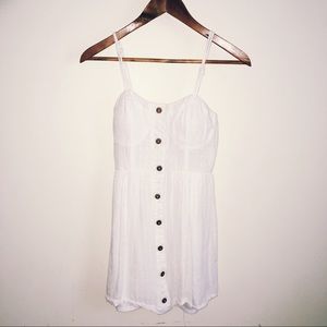 White dress with brown bottoms down the center.