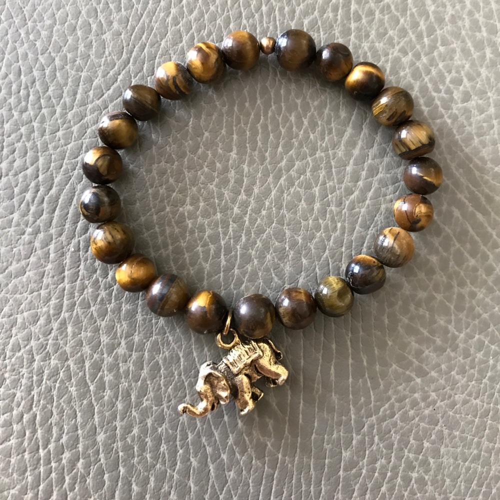 Wood bead bracelet w antique gold elephant charm