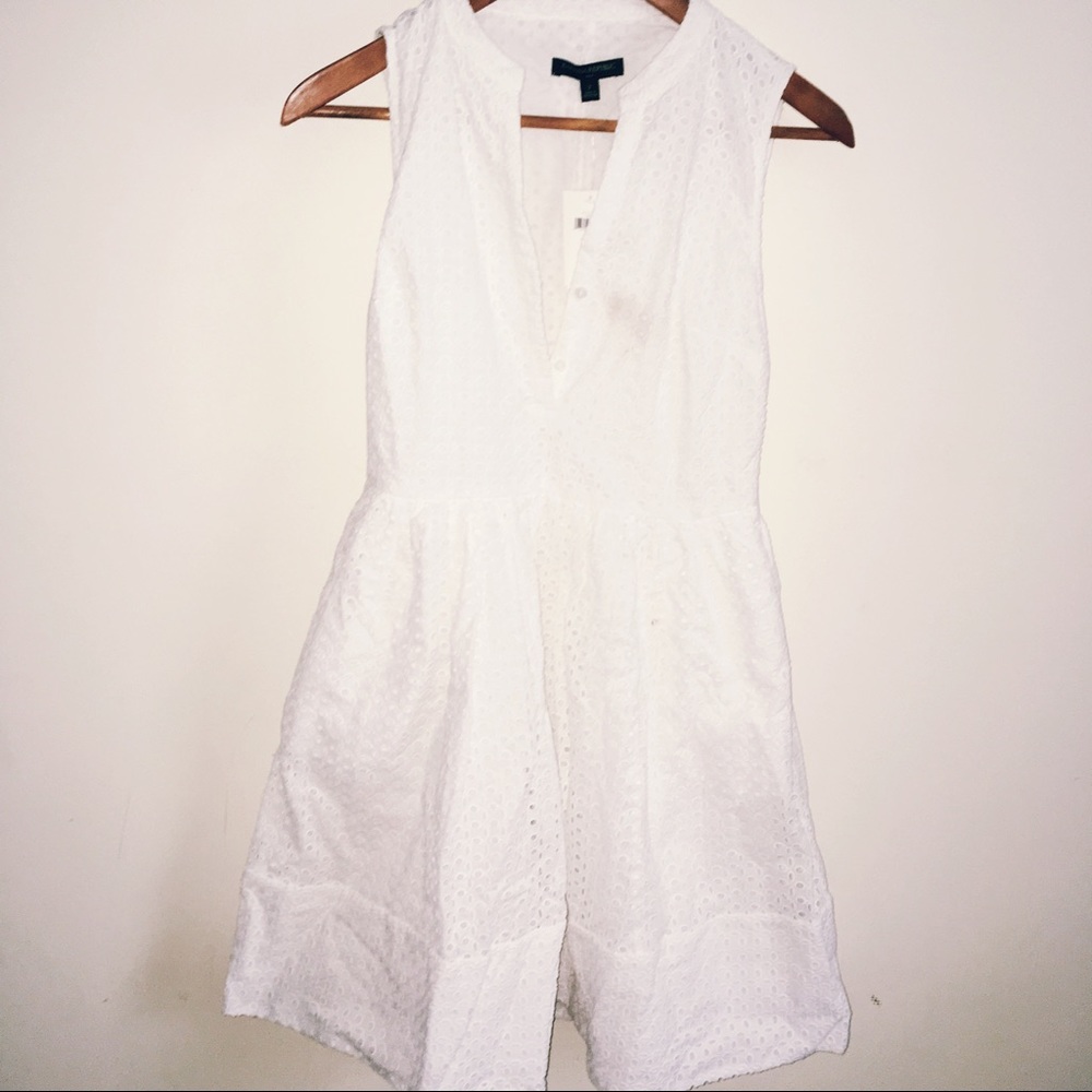 White dress with petal patterns.