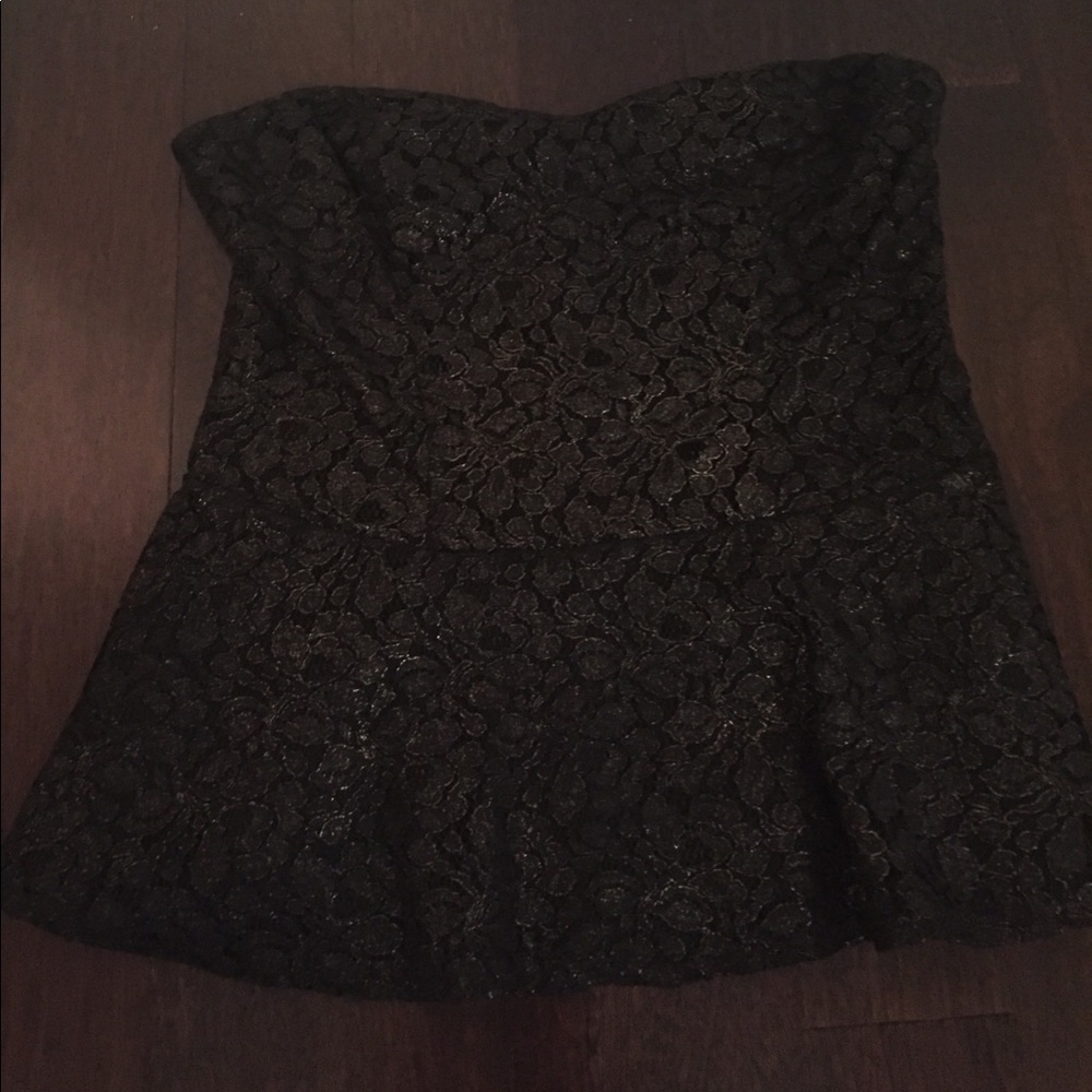 Strapless, peplum too. Gold shimmer throughout.