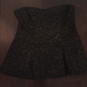 Strapless, peplum too. Gold shimmer throughout.