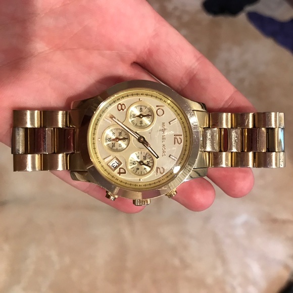 Women's gold Michael Kors watch