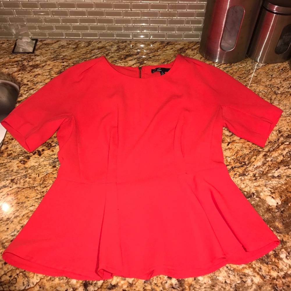 Red zip up top