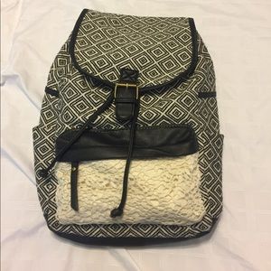 Black and cream patterned backpack