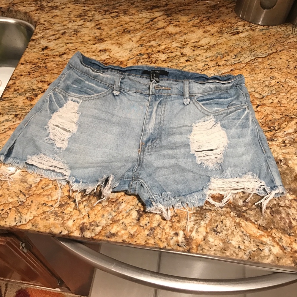 Distressed blue jean shorts