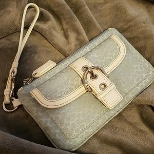 Small blue coach clutch