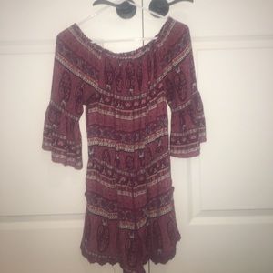 Maroon patterned romper.