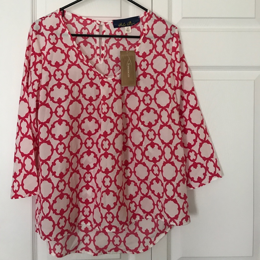Pink and white patterned blouse