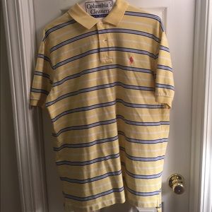 Light yellow polo with blue and white stripes.