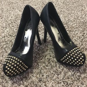 Black platform pumps w/ gold studs