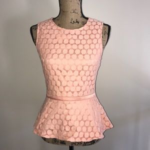 Coral peplum top with open back
