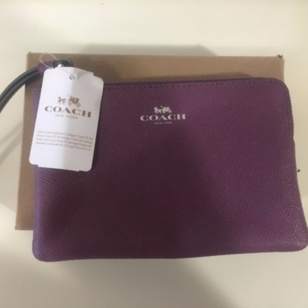 Purple coach wrislet purse