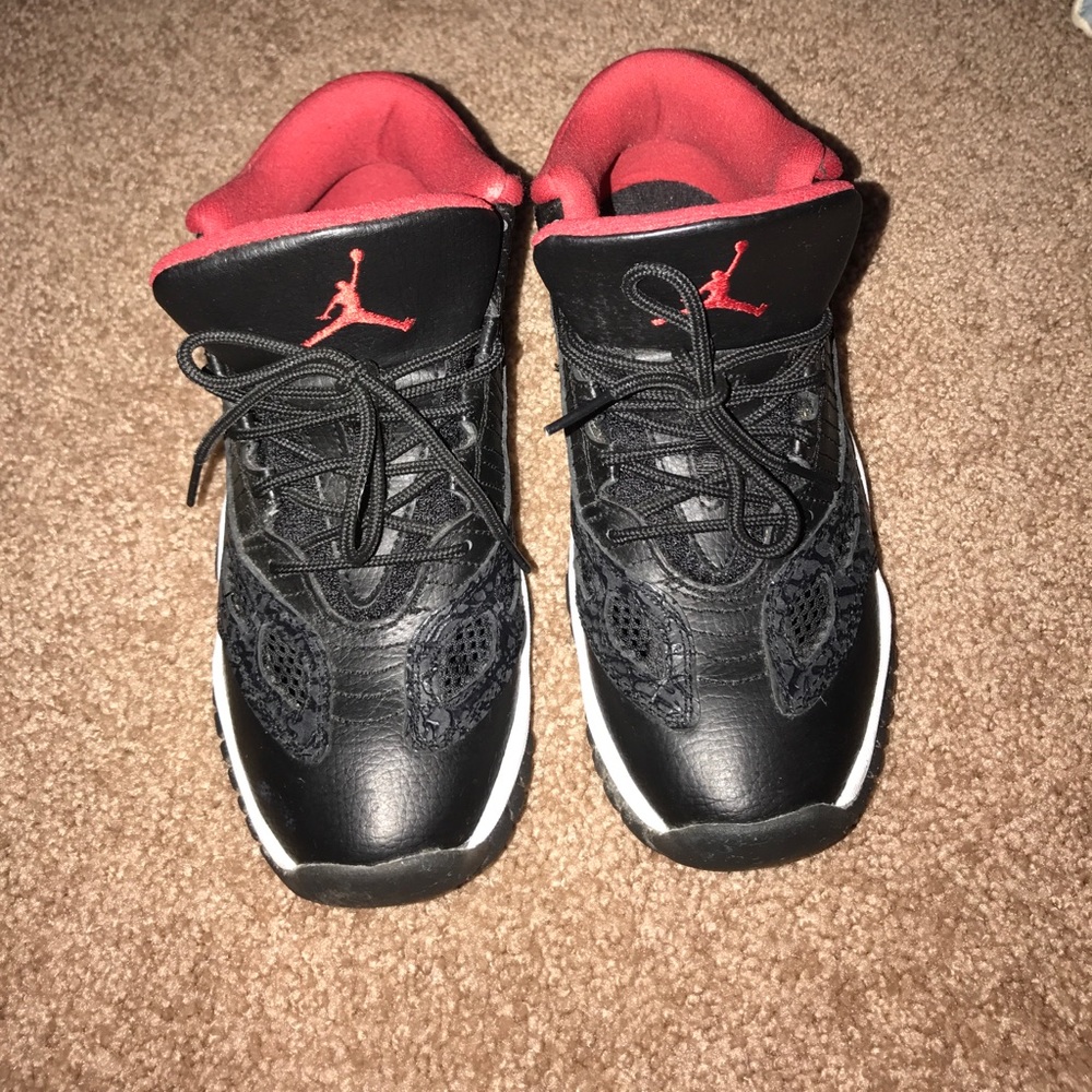 Red/black Jordan 11s