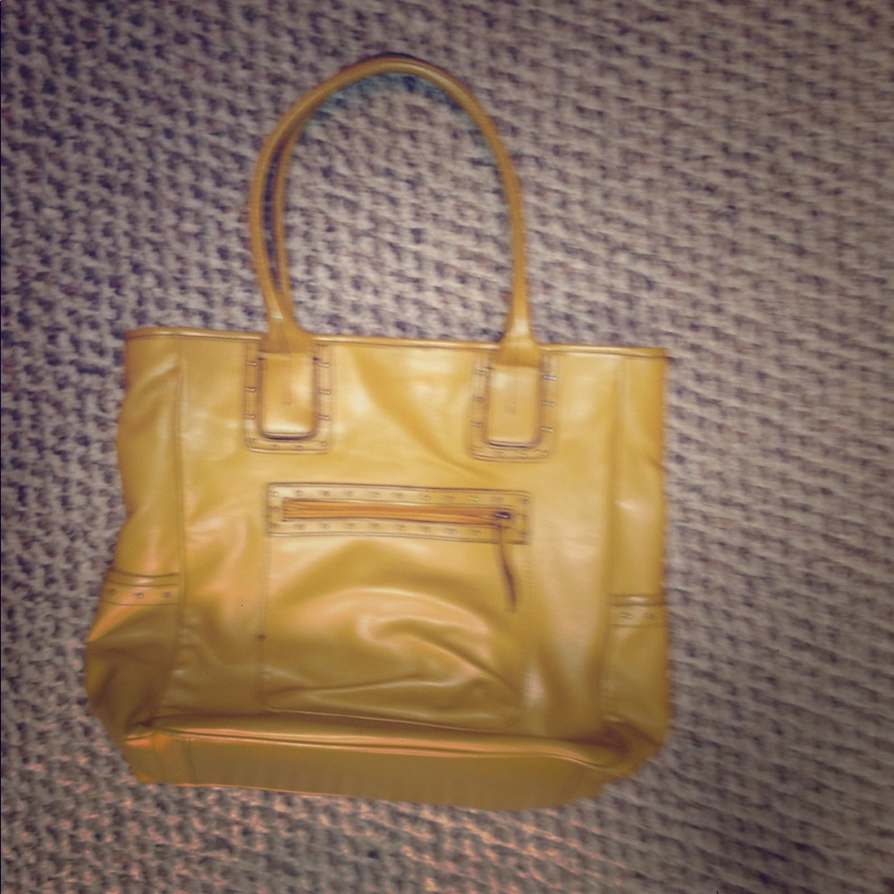 Mustard yellow purse. In not sure what brand