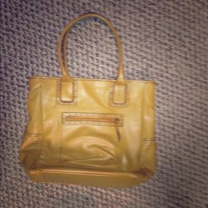 Mustard yellow purse. In not sure what brand