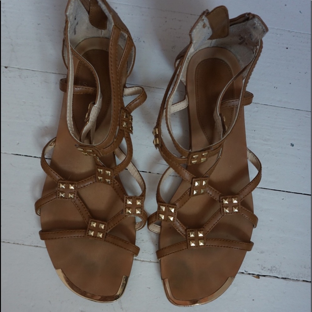 Brown sandals with gold accents