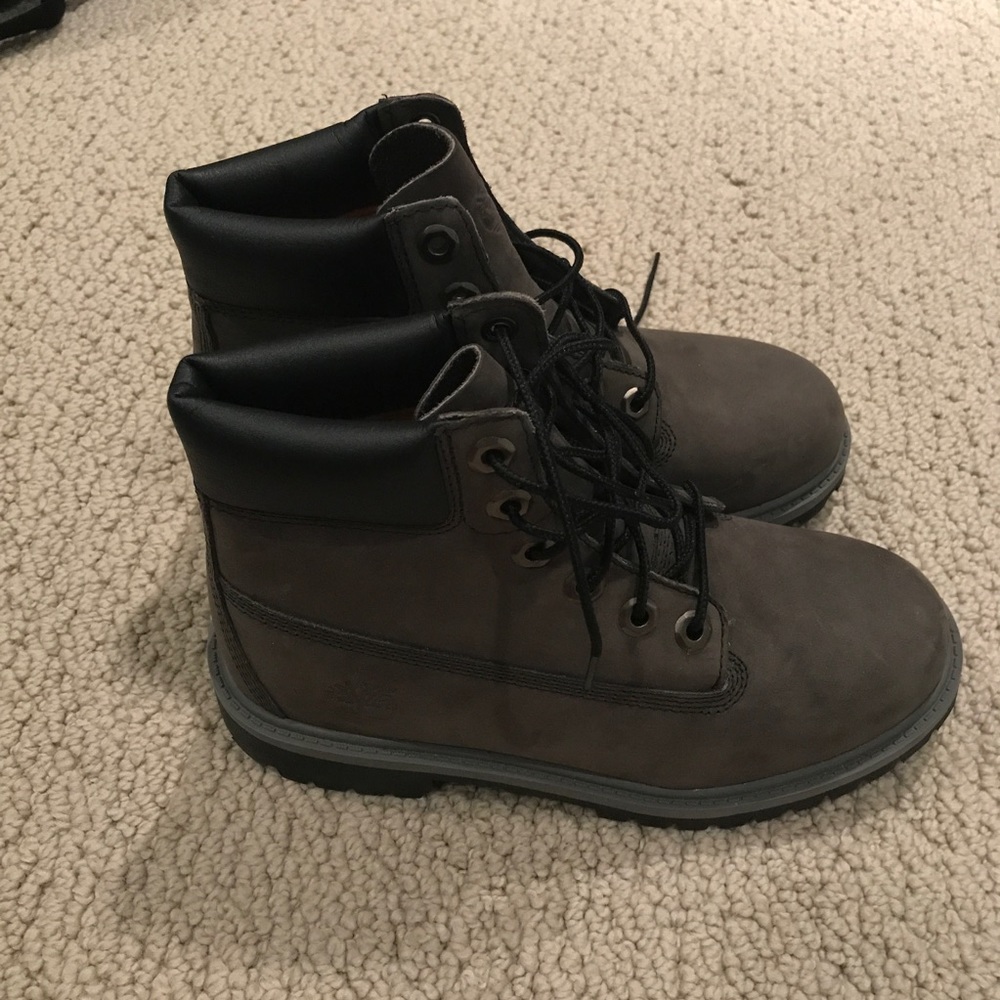 Gray and black Timberland boots