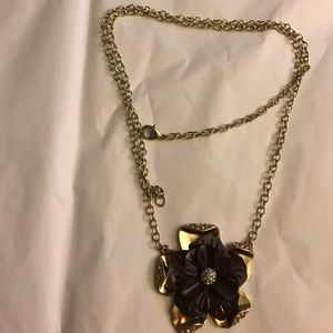Gold necklace with purple flower