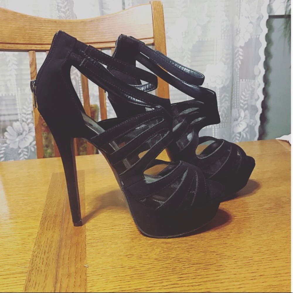 Black suede stiletto pumps.