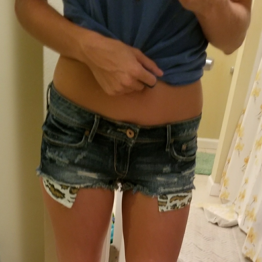 Low rise denim cut offs with cheetah pockets