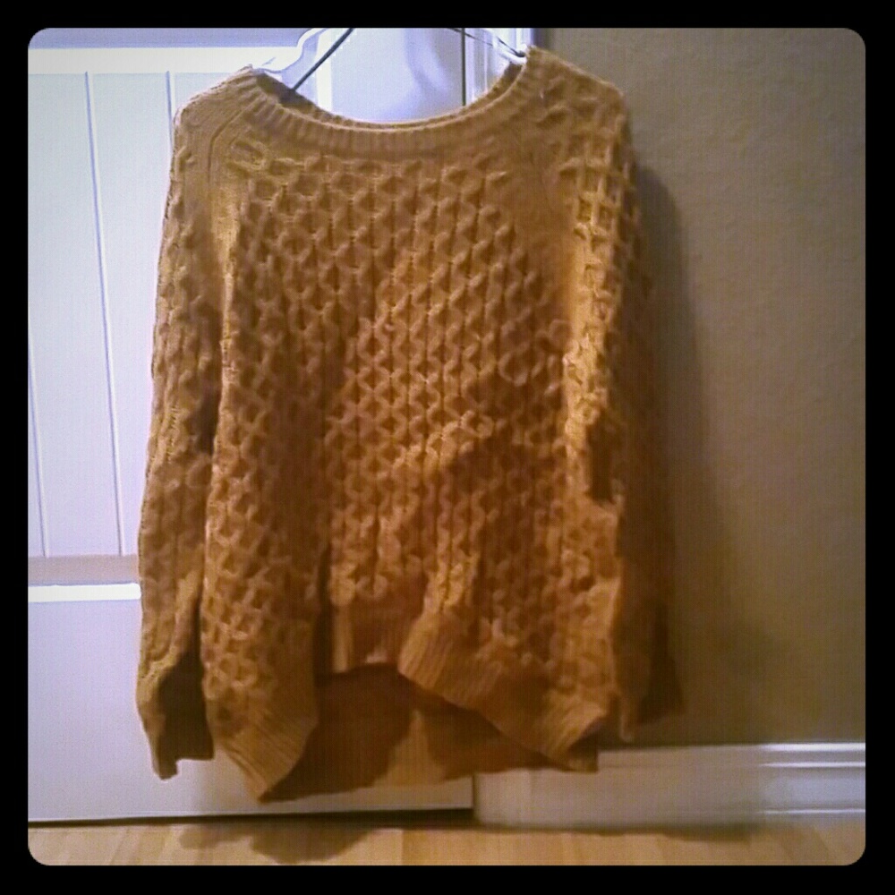 A mustard yellow sweater