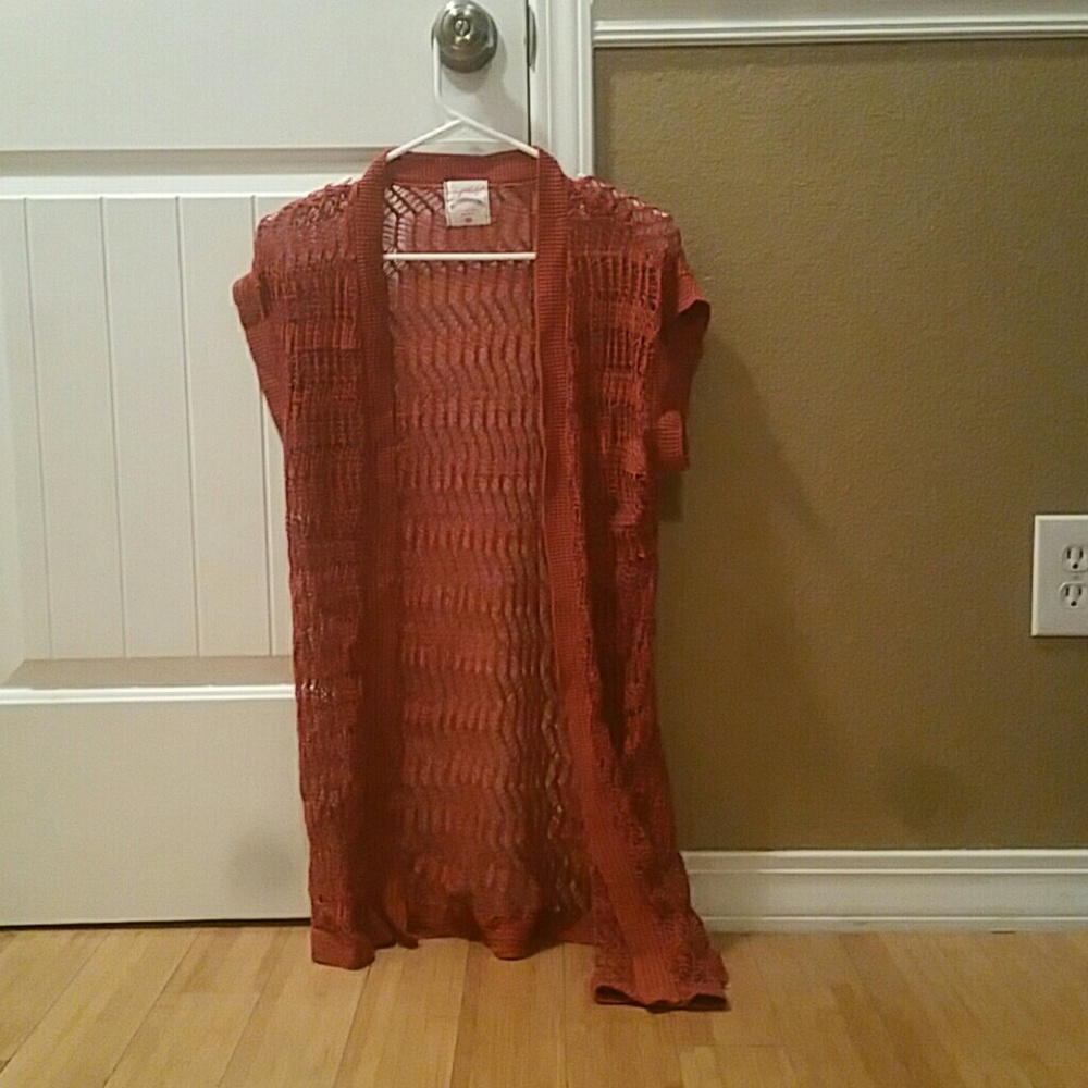 Red-ish orange sweater