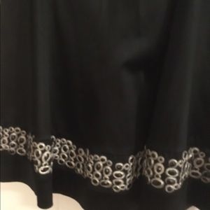 Sleeveless navy satin fit and flair dress.