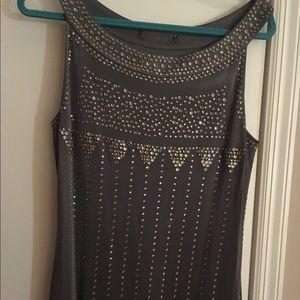 Funky gray slinky dress with metal grommets.