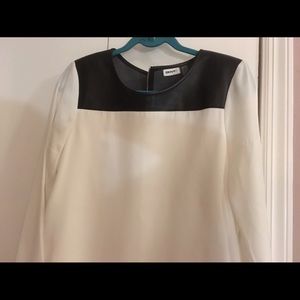 White top with black leather trim