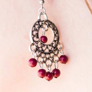 Silver tone earrings with pink beads