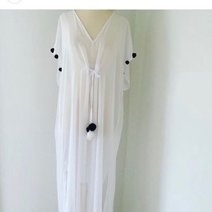 white beach cover up with black & white pompons
