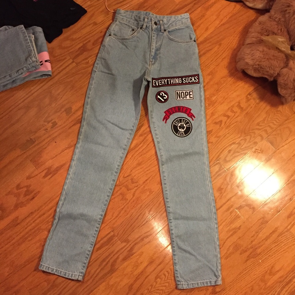 The ragged priest patched jeans