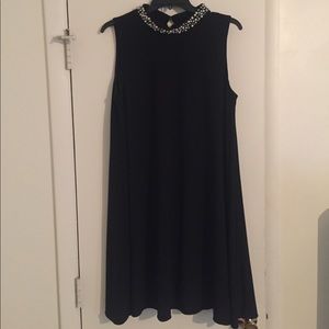 Sleeveless black swing dress