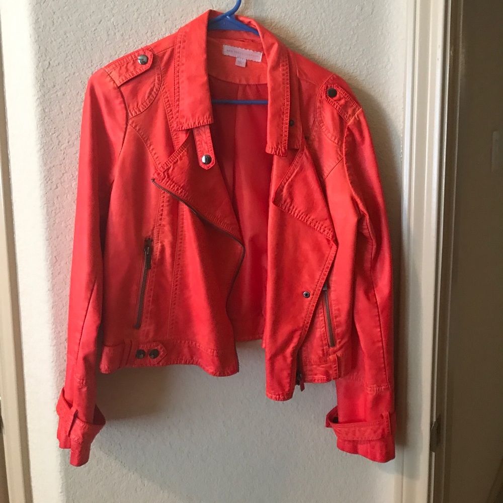 Bright coral leather bomber jacket.