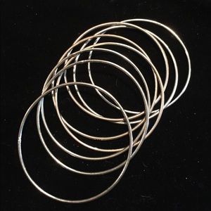 (8) silver tone bangles