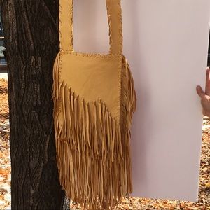 Gold deer skin fringed bag