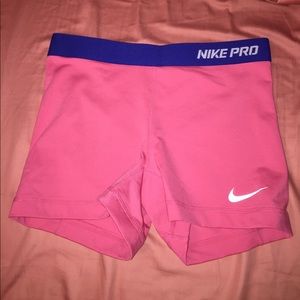 Pink Nike pros with blue waist band