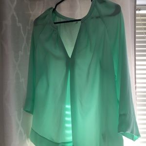 Sea foam semi sheer blouse.