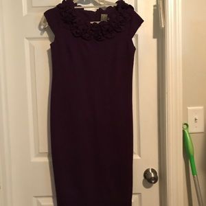 Purple dress with flowers around the neck