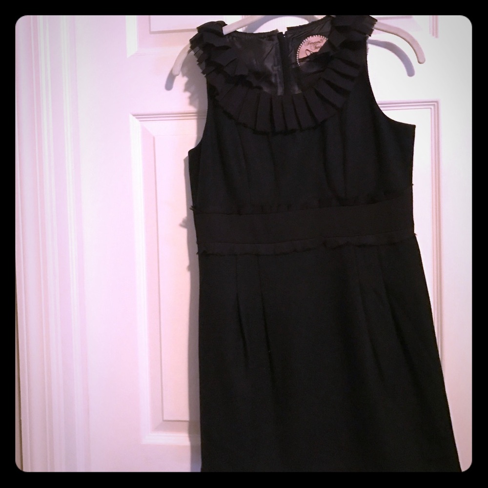 Dress with ruffle at top