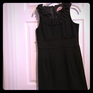 Dress with ruffle at top