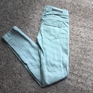 Faded mint blue jeans