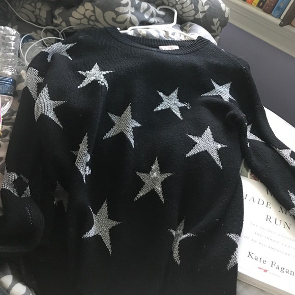 gray sweater with black stars